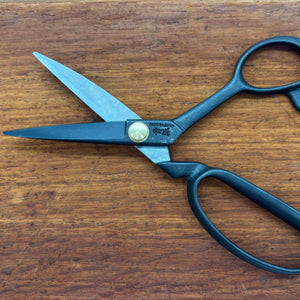 Black Masamune tailor scissors open on timber surface, full product view