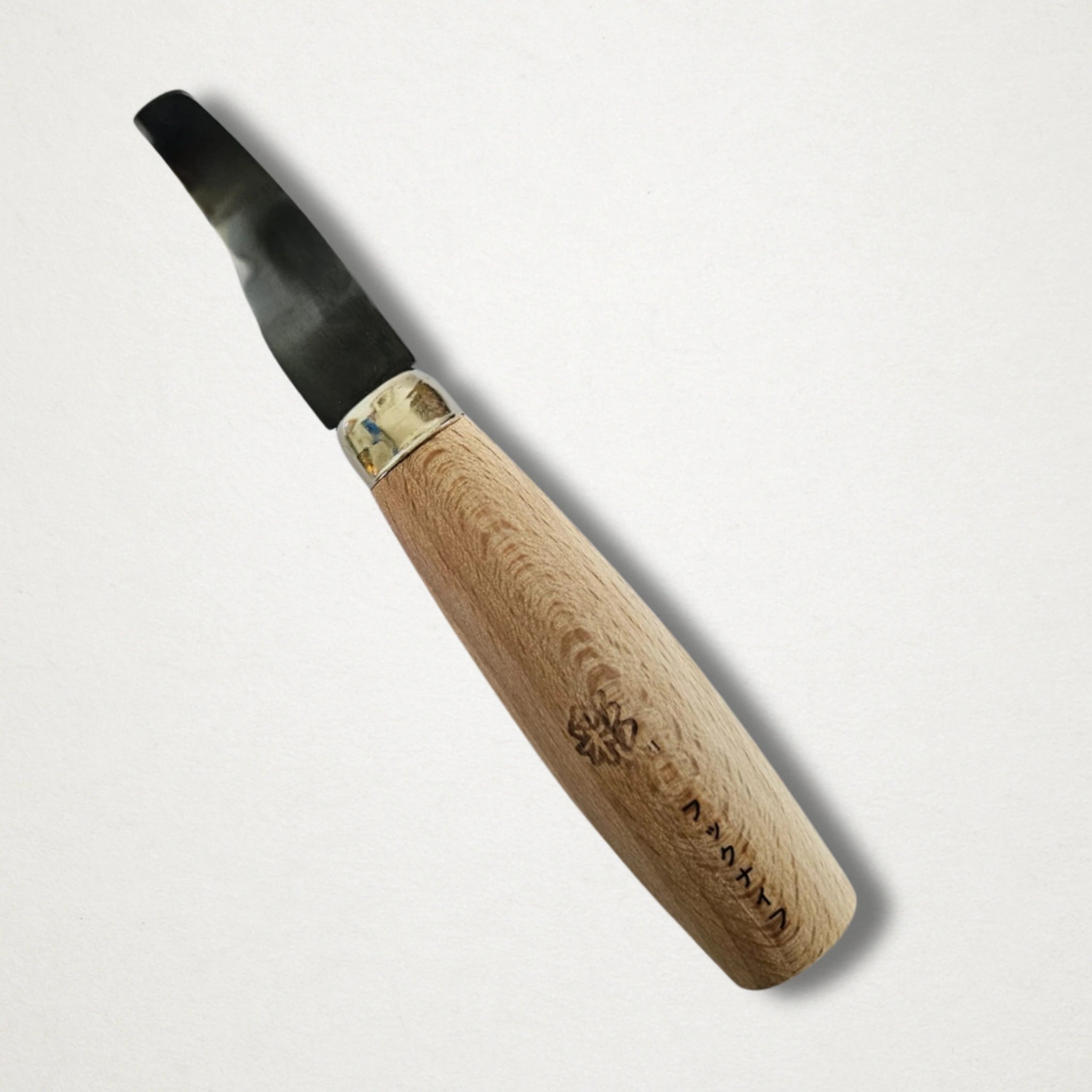 Close-up of Michi Hamono hook carving knife blade and handle junction