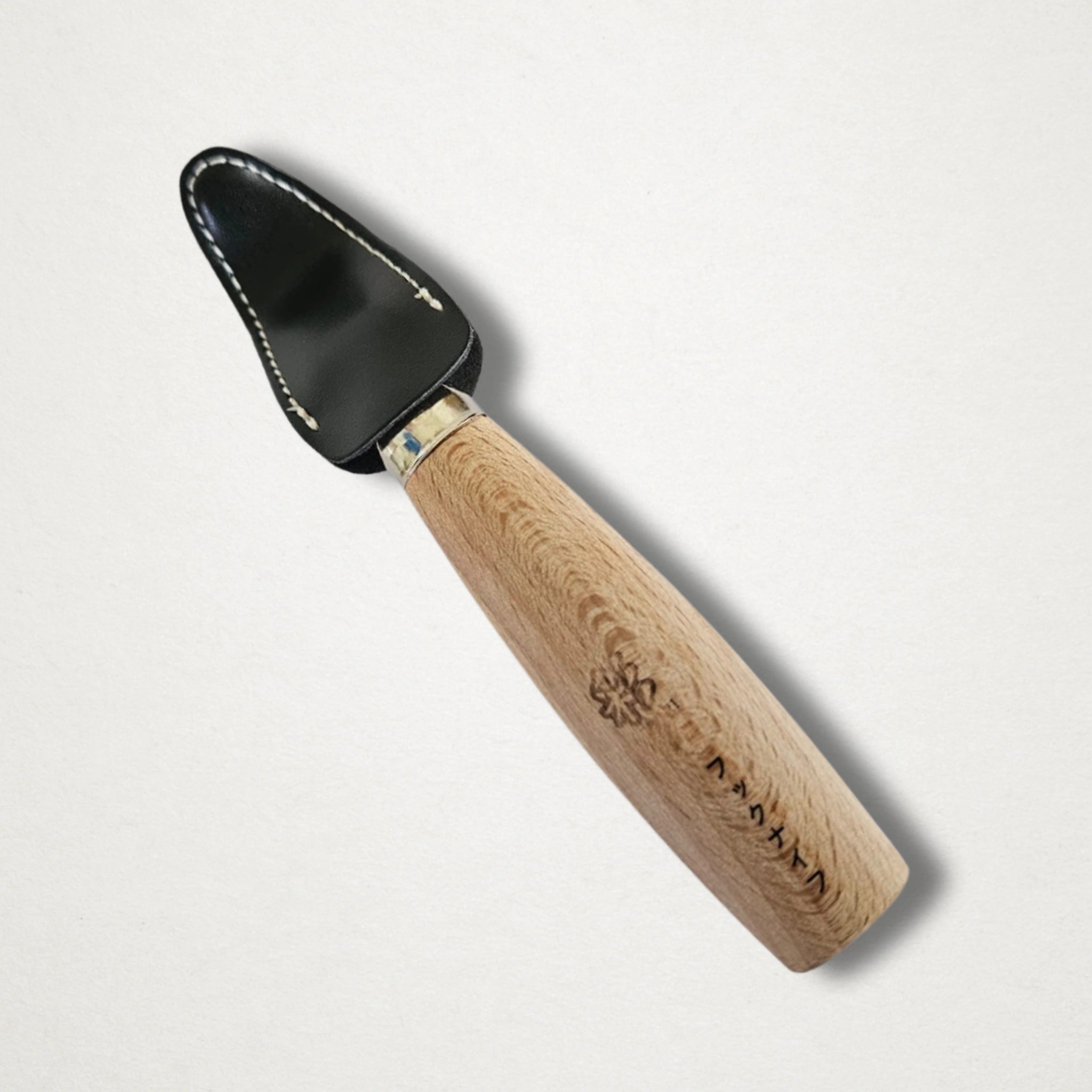 Michi Hamono hook carving knife shown from above with curved cutting edge visible