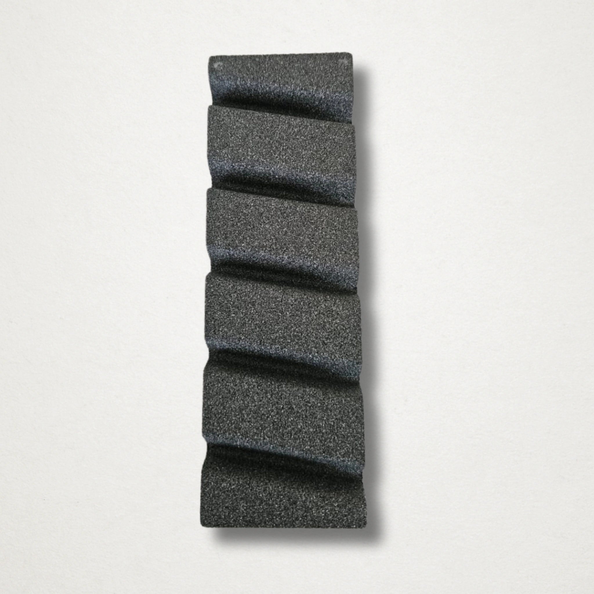 Grooved flattening stone surface showing channels for whetstone maintenance